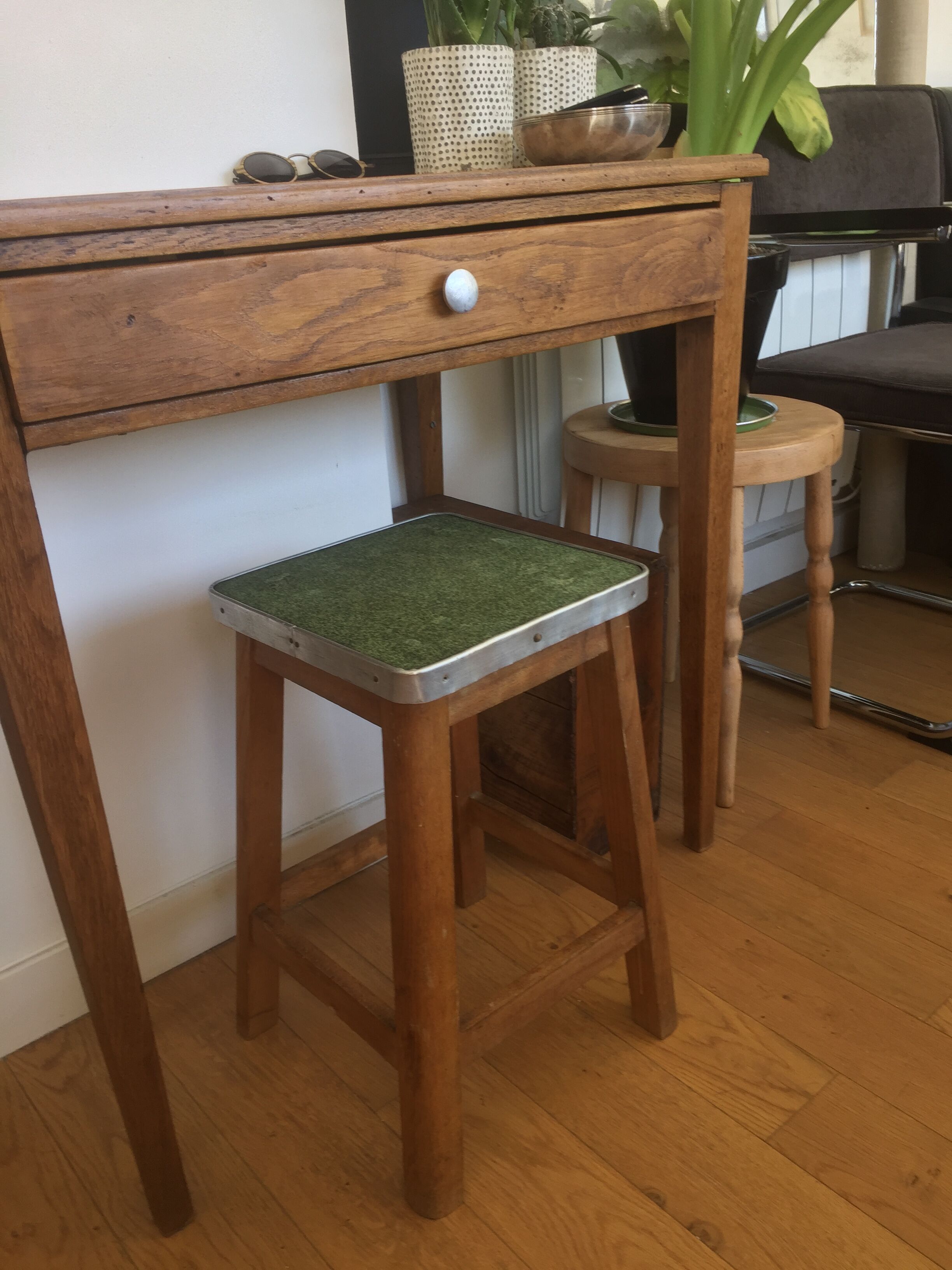 Wooden stool and green seat