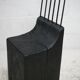 Brutalist chair, black-stained raw wood, steel. Work from the 1970s