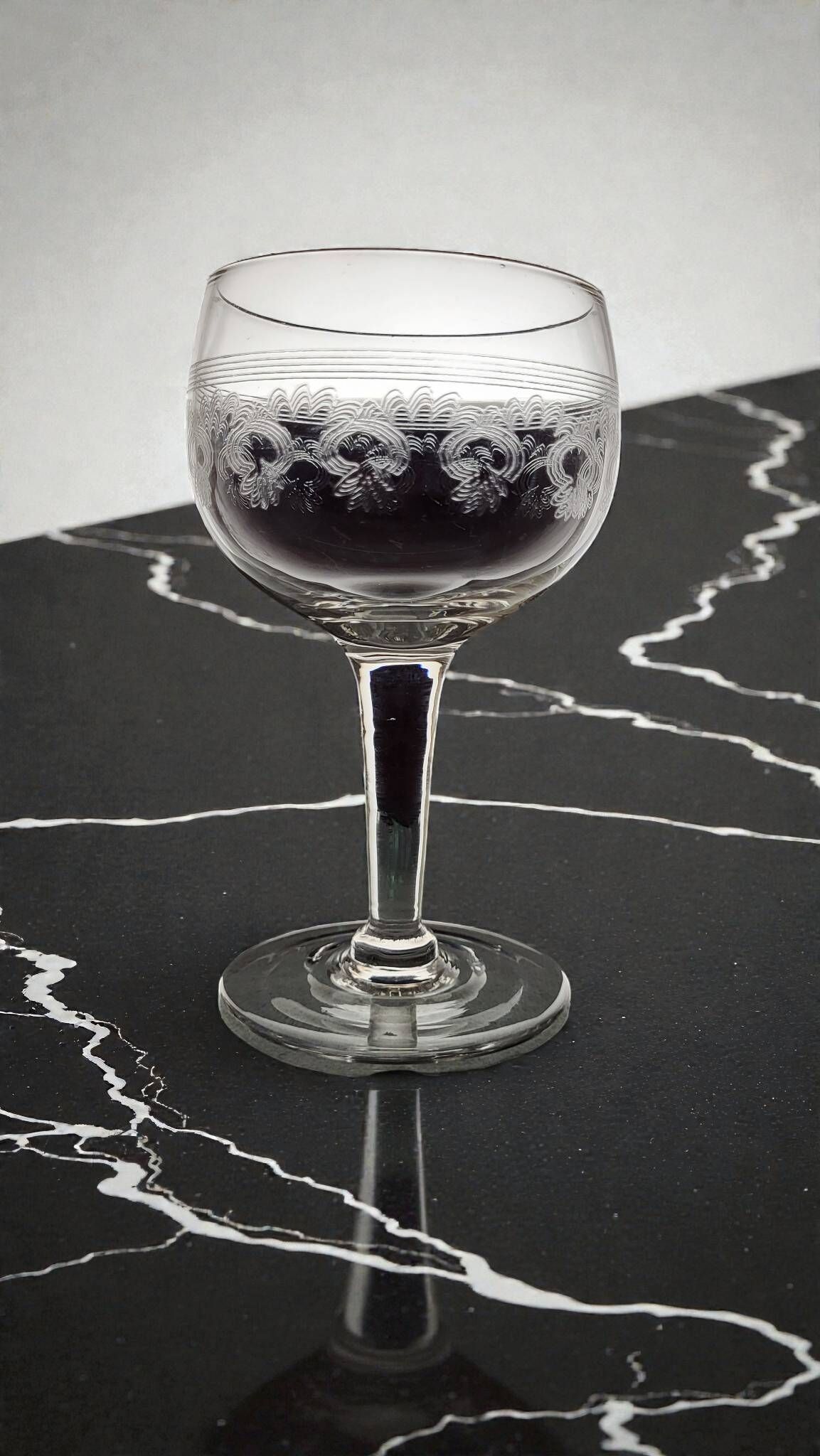9 guilloché wine glasses, early 20th century.