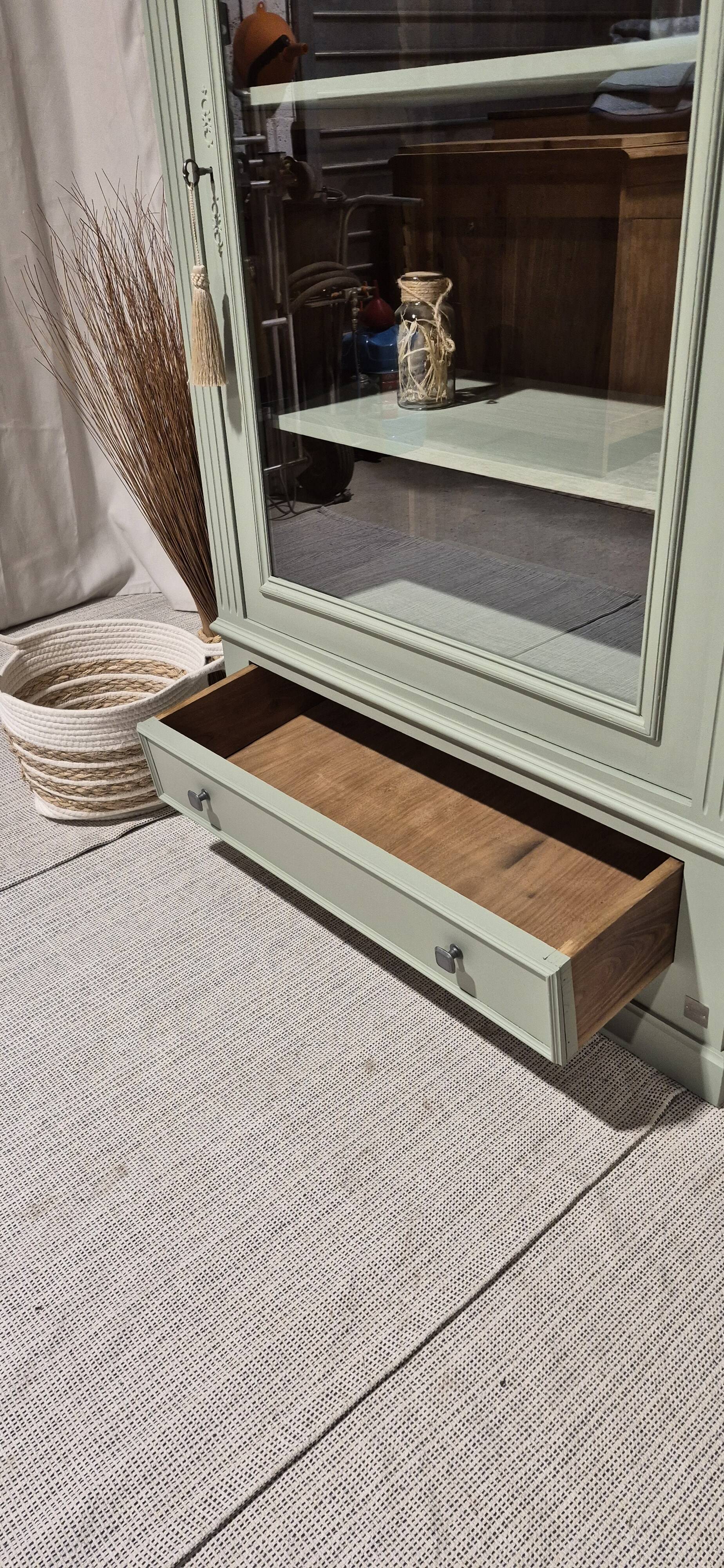 Glass display cabinet with drawer