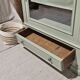 Glass display cabinet with drawer