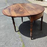 Half moon console opening on a solid walnut round table