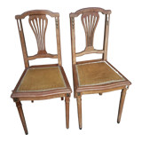 Pair of old chairs with brass elements