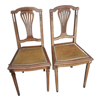 Pair of old chairs with brass elements