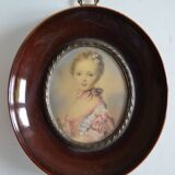 Miniature portrait of a young girl, framed and under glass