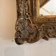 Antique Louis XV style mirror in gilded stucco.