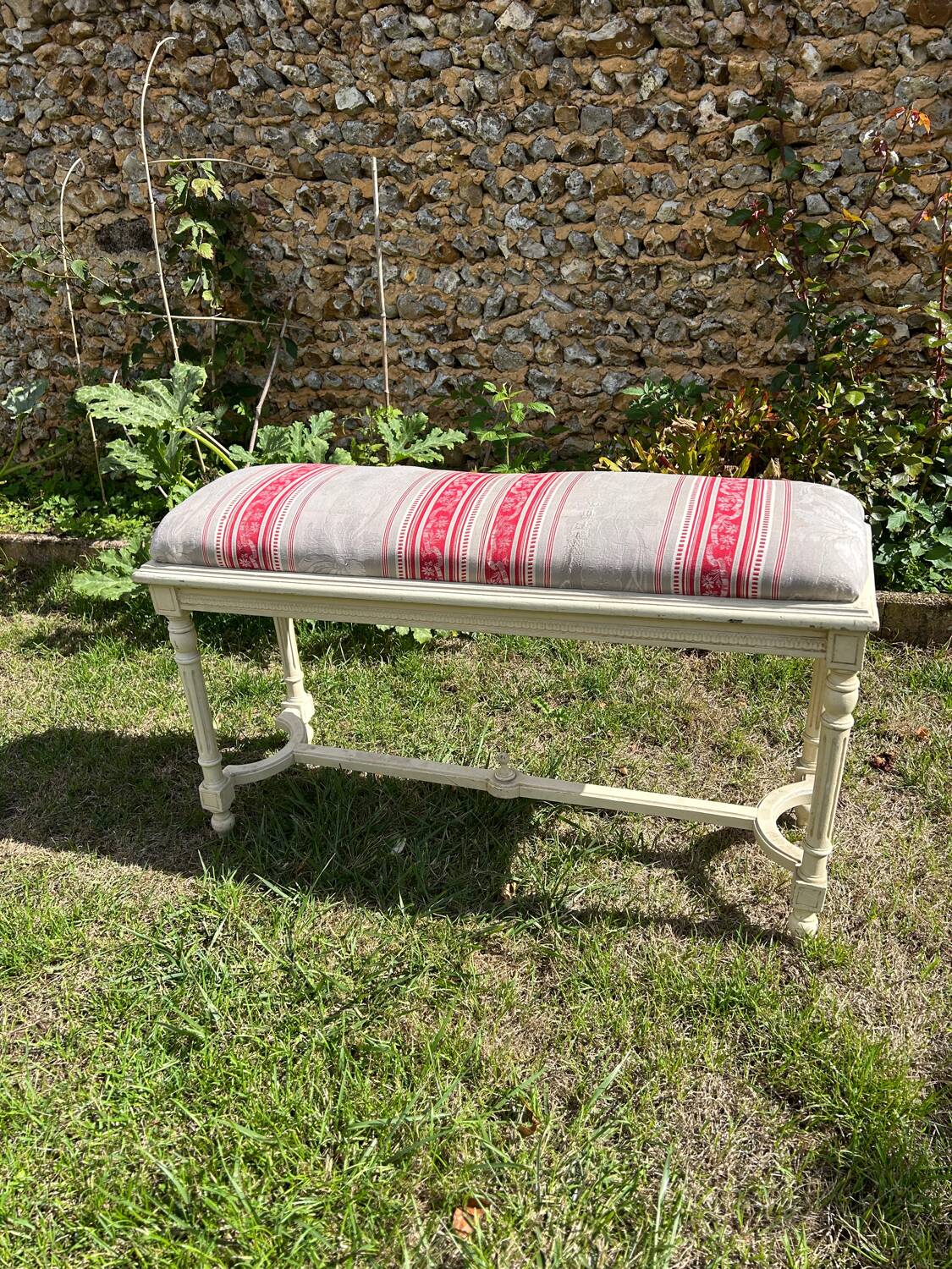 Louis XVI style bench at the end of the bed