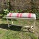 Louis XVI style bench at the end of the bed