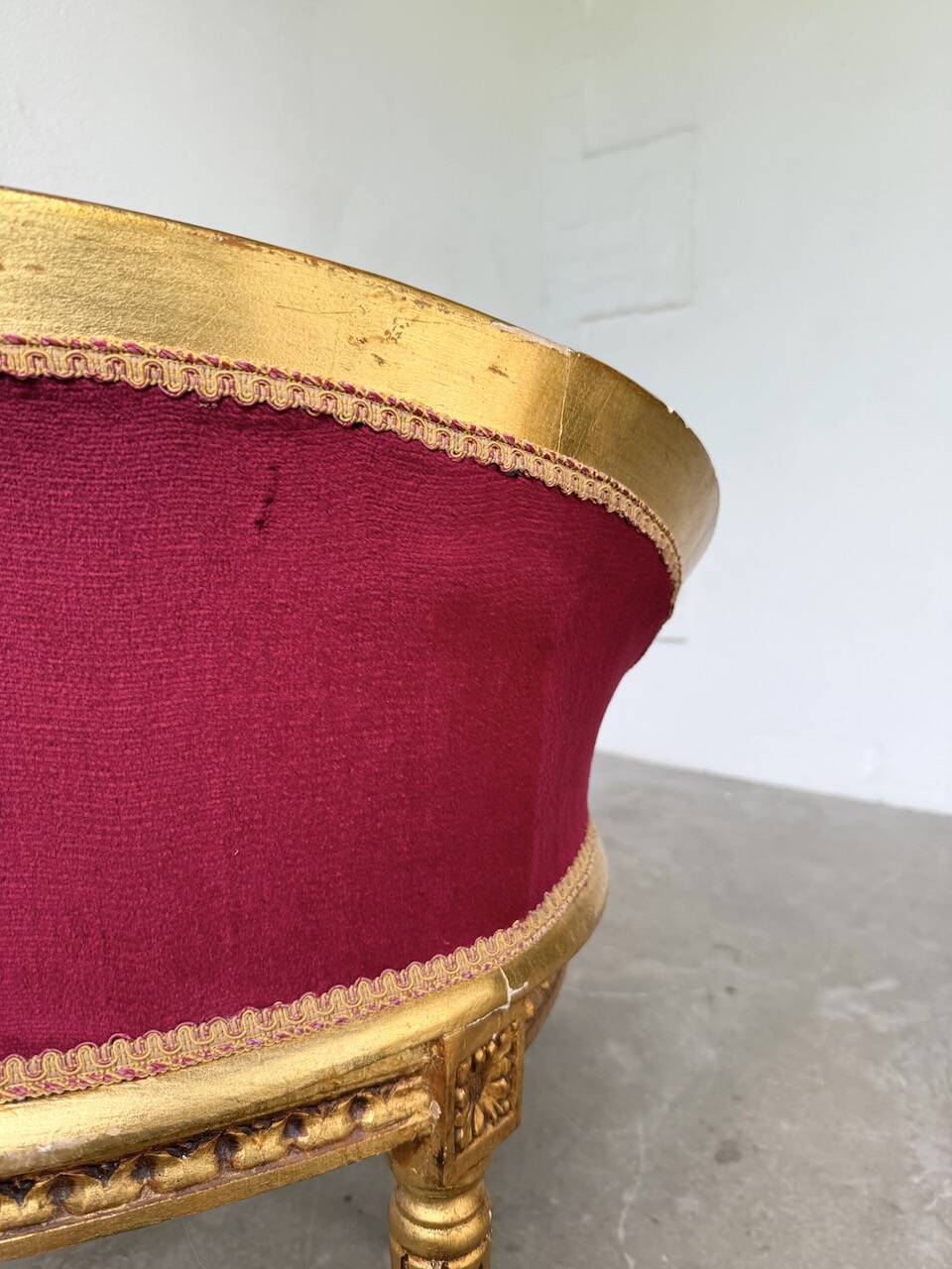 Louis XVI gilt wood and red velvet armchair