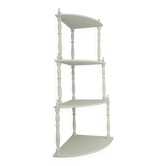 Corner shelf made of turned wood painted white.