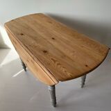 Round wooden table with flaps