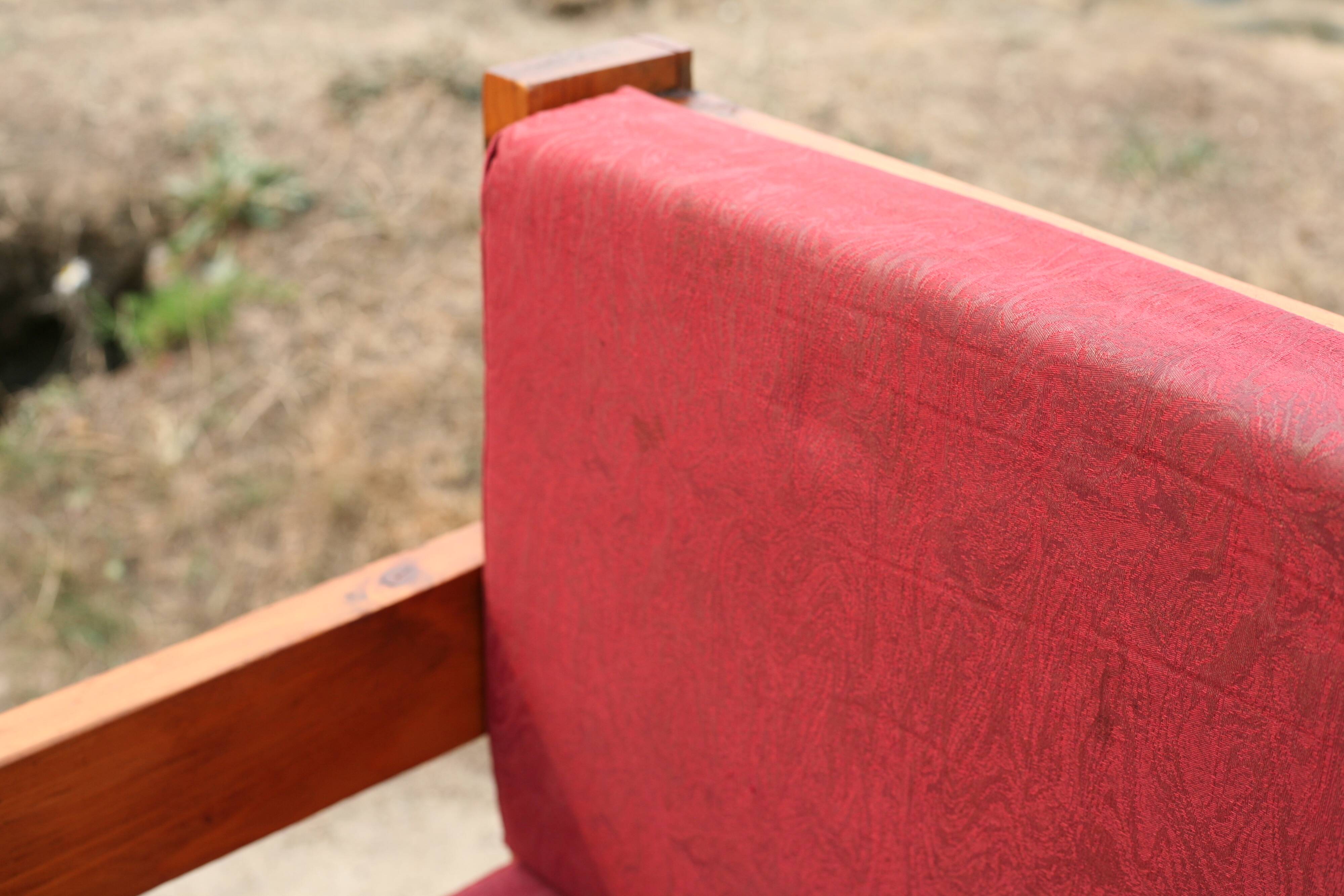 Pair of pine fireside chairs, France, 1960s, "raspberry" cushions