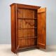 Vintage walnut wardrobe with exposed hardware.