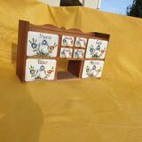 Vintage wooden spice rack with ceramic drawers