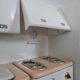 Miniature vintage toy kitchen