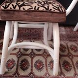 4 white rattan chairs