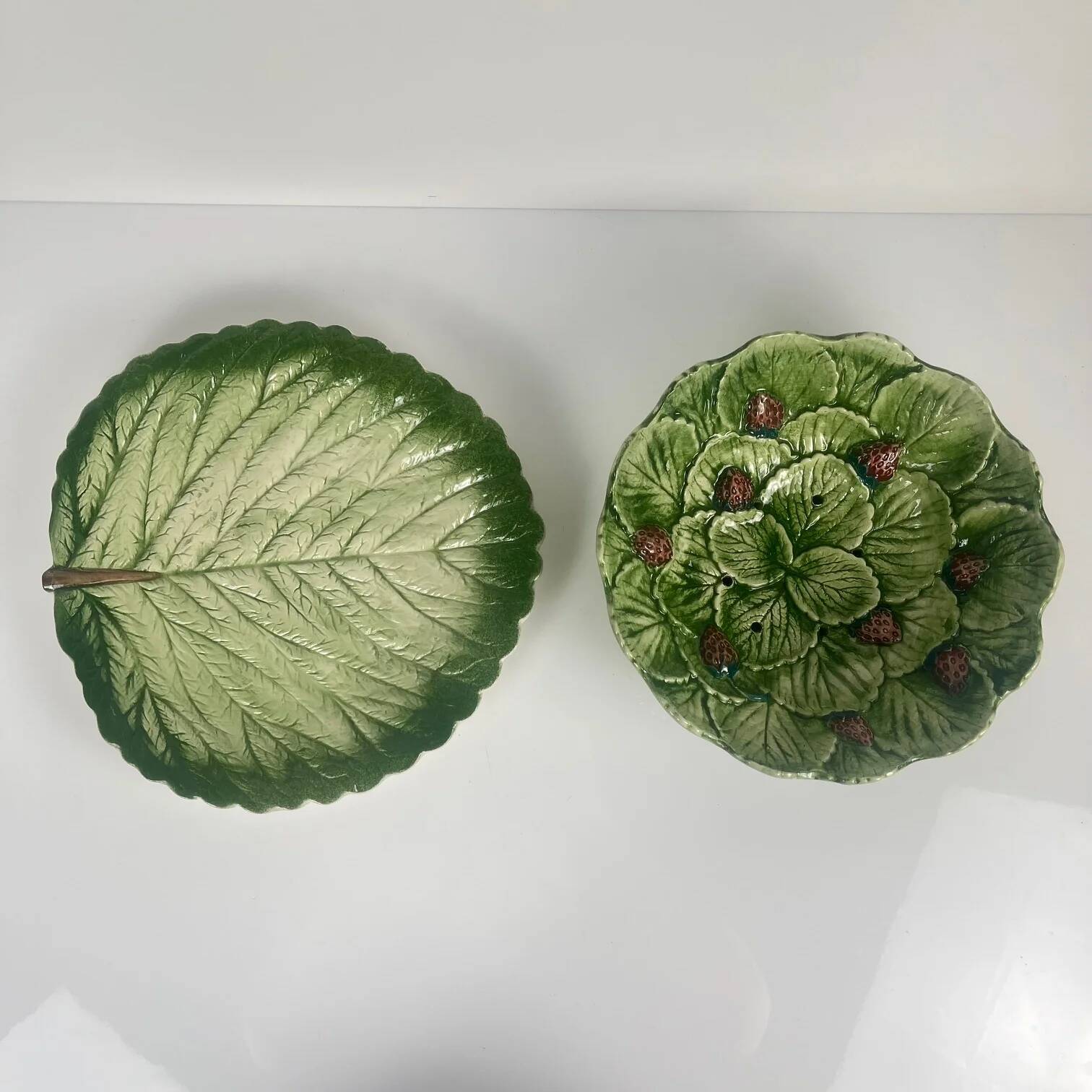 Leaf and strawberry-shaped bowl/strainer.