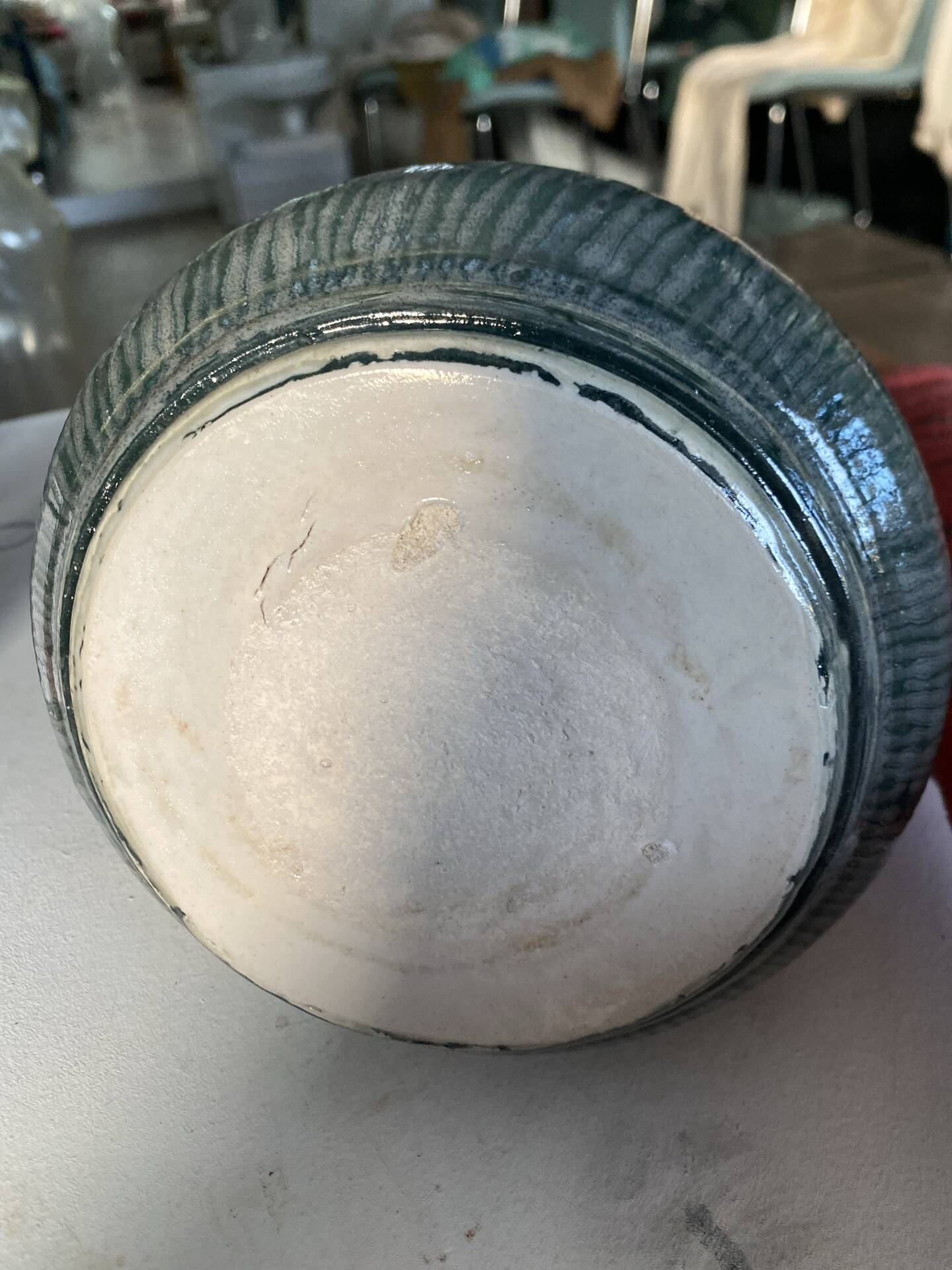 New green ceramic artisanal vase.