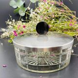 Vintage box made of chiseled glass and covered metal, taken in black Bakelite