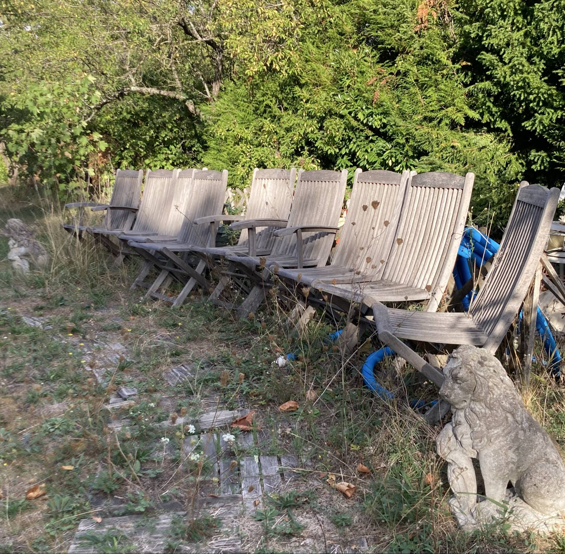 Folding garden chairs and armchairs in River Han dowelled teak.