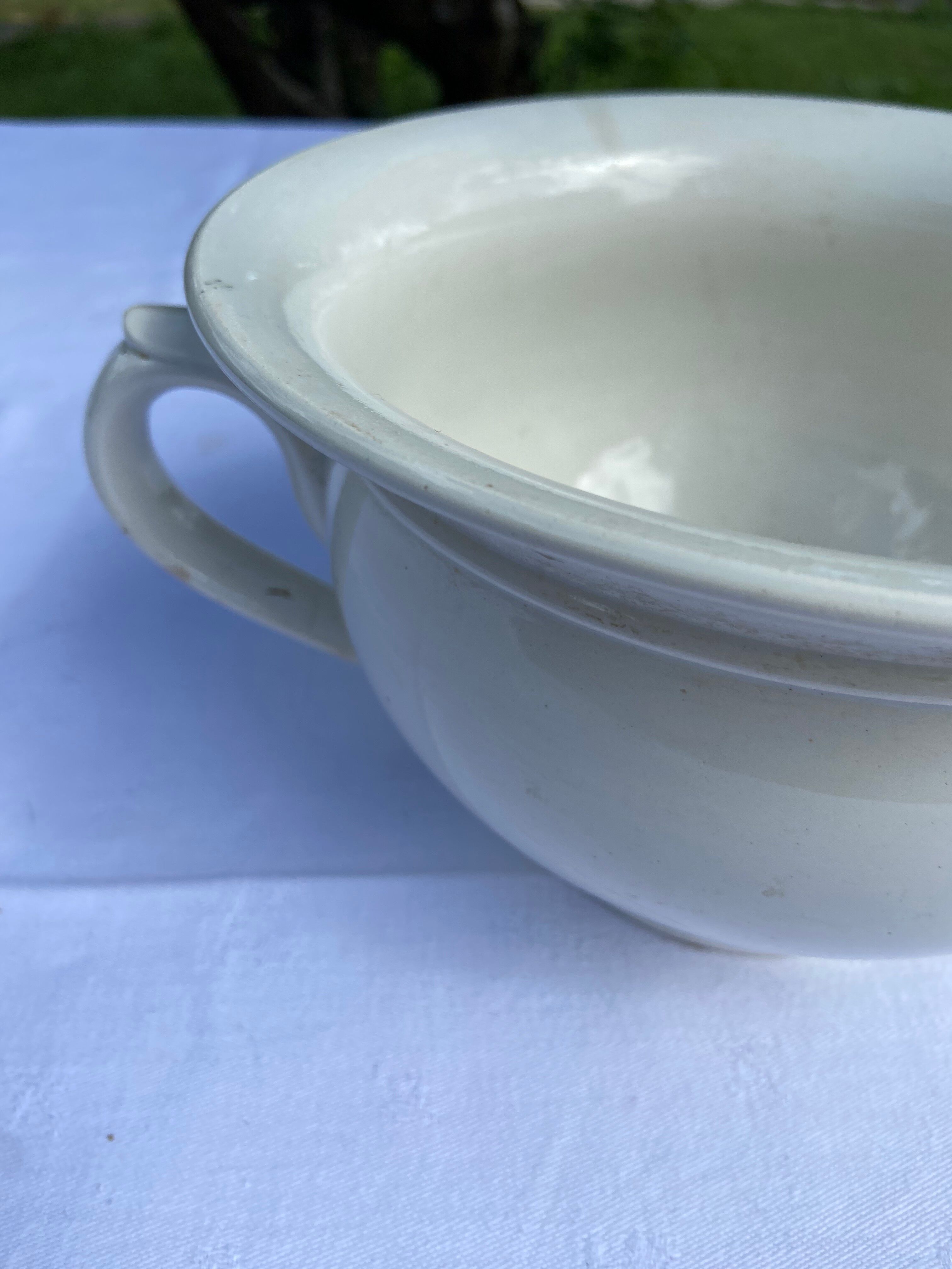 Old Digoin chamber pot in white earthenware – repurposed as a dice bowl.