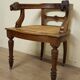 Fauteuil de bureau style Renaissance ancien en bois sculpté et assise cannée