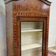 Antique Louis XV display cabinet with geometric marquetry decoration.