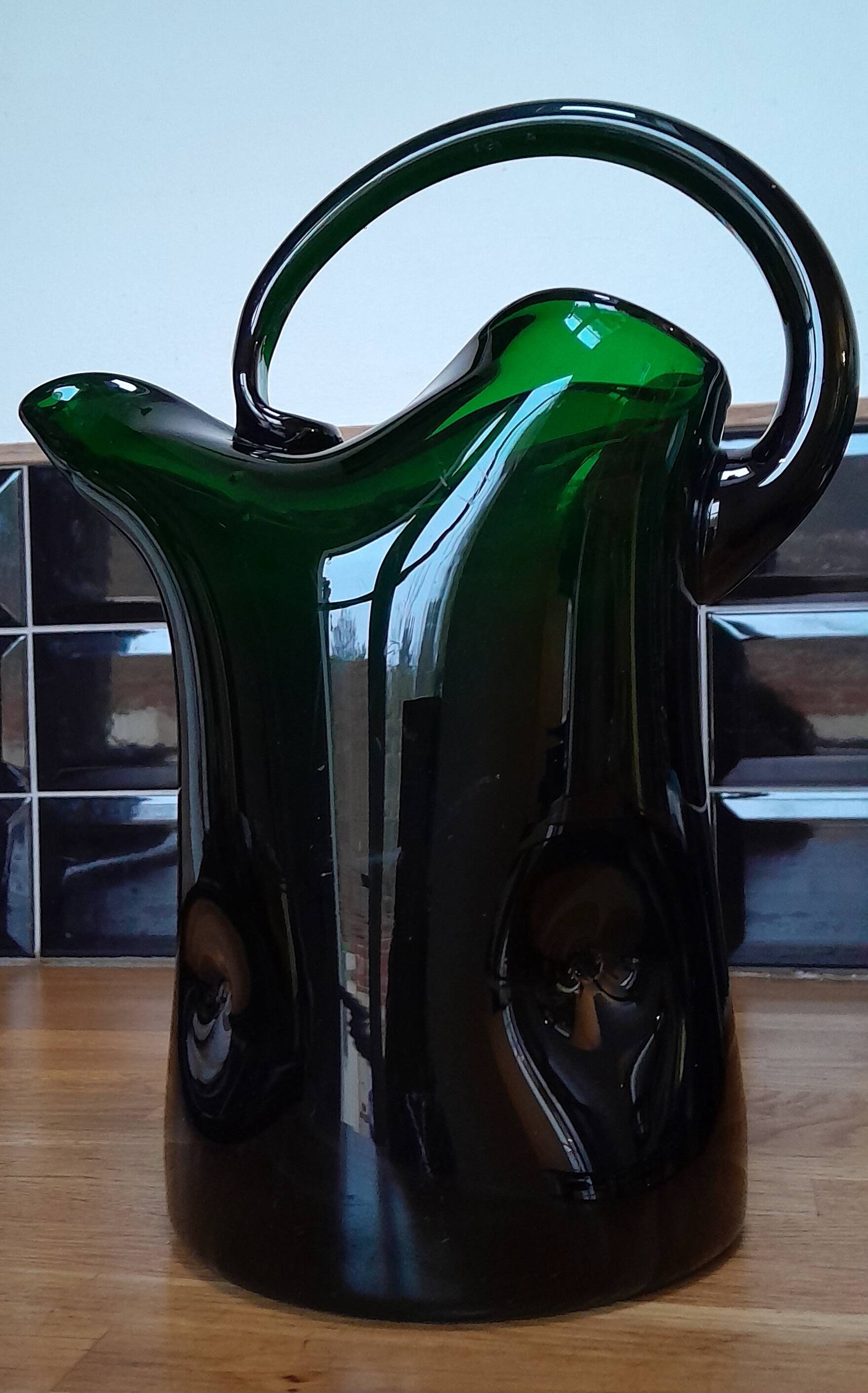 Blown glass pitcher filled