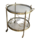 Round brass rolling table attributed to Maison Jansen