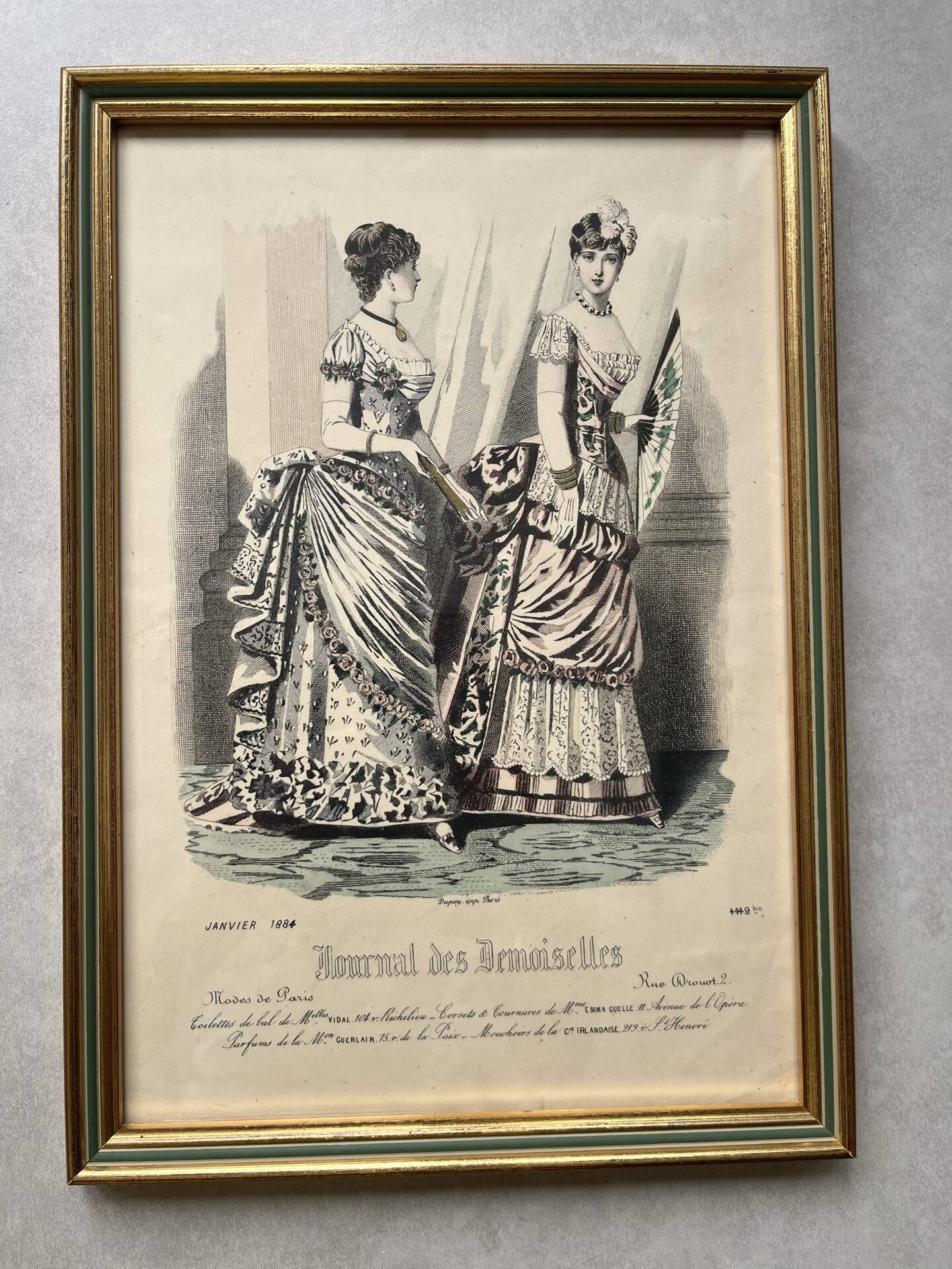 Pair of framed fashion engravings from the 19th century.