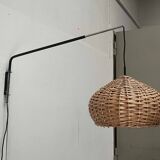 Mid-century modern Danish extendable cantilever wall lamp with a rattan shade, 1960s.