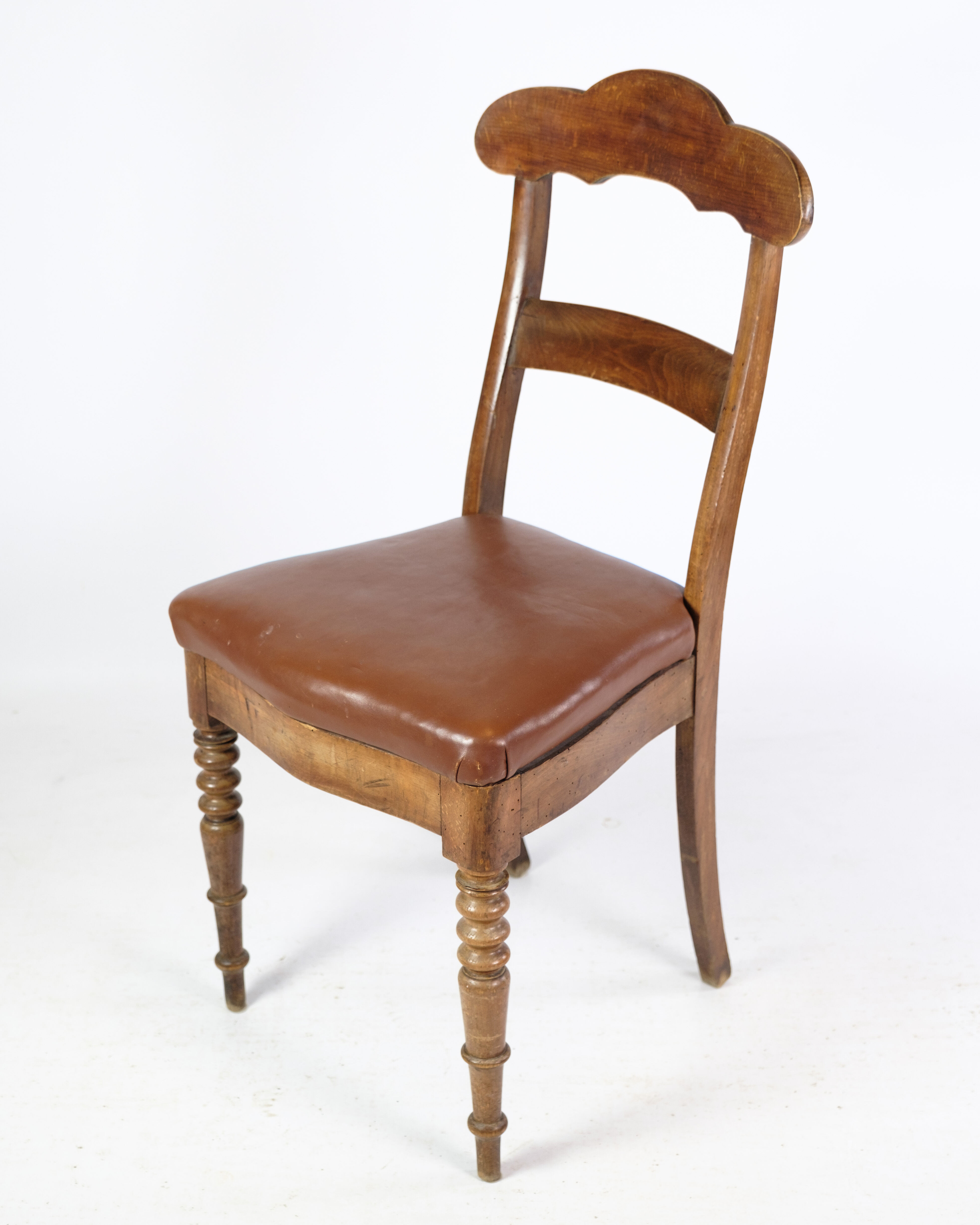 Set of eight late empire chairs in high quality brown leather in mahogany