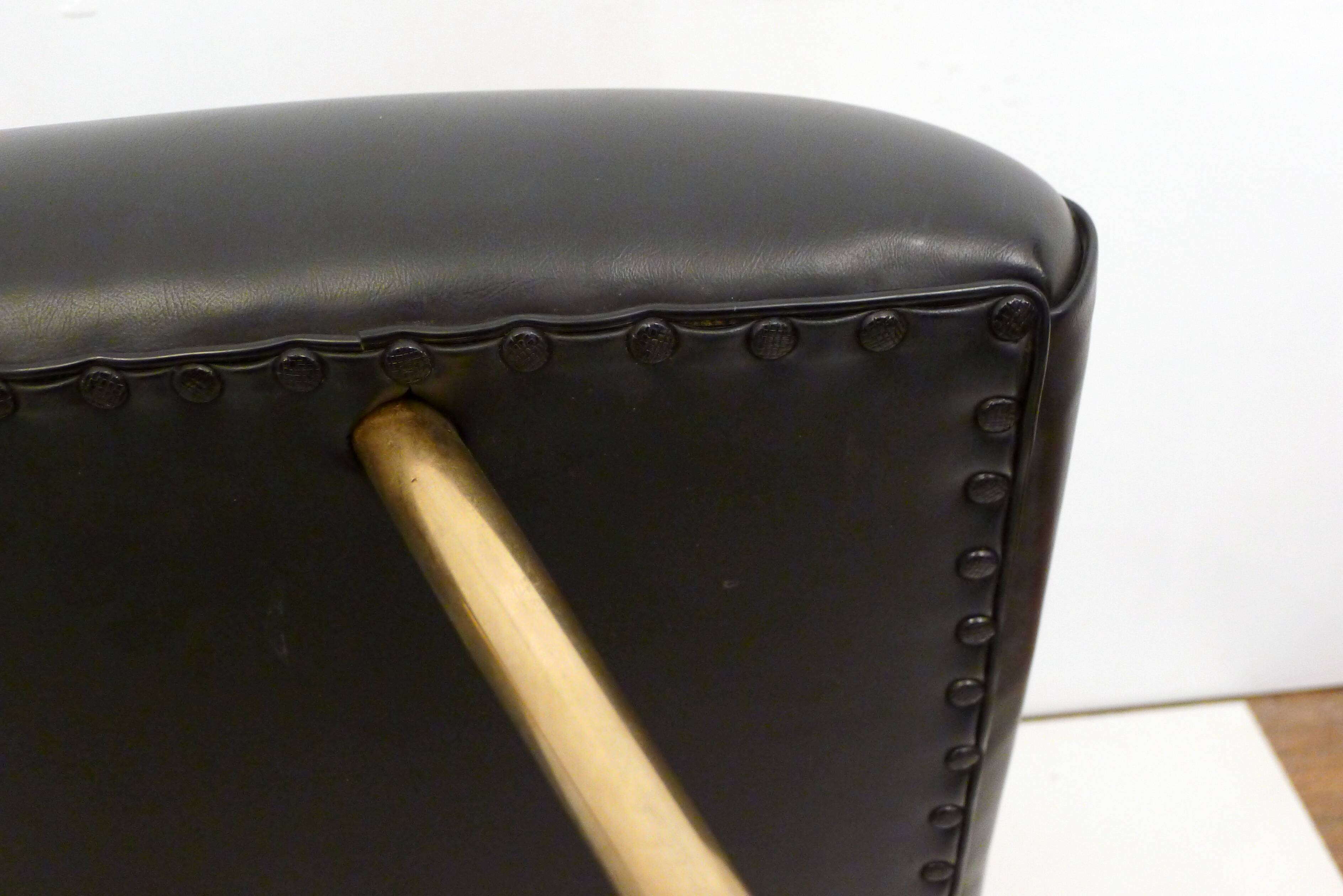 Footrest / stool 1960s with tapered gold legs & faux leather seat