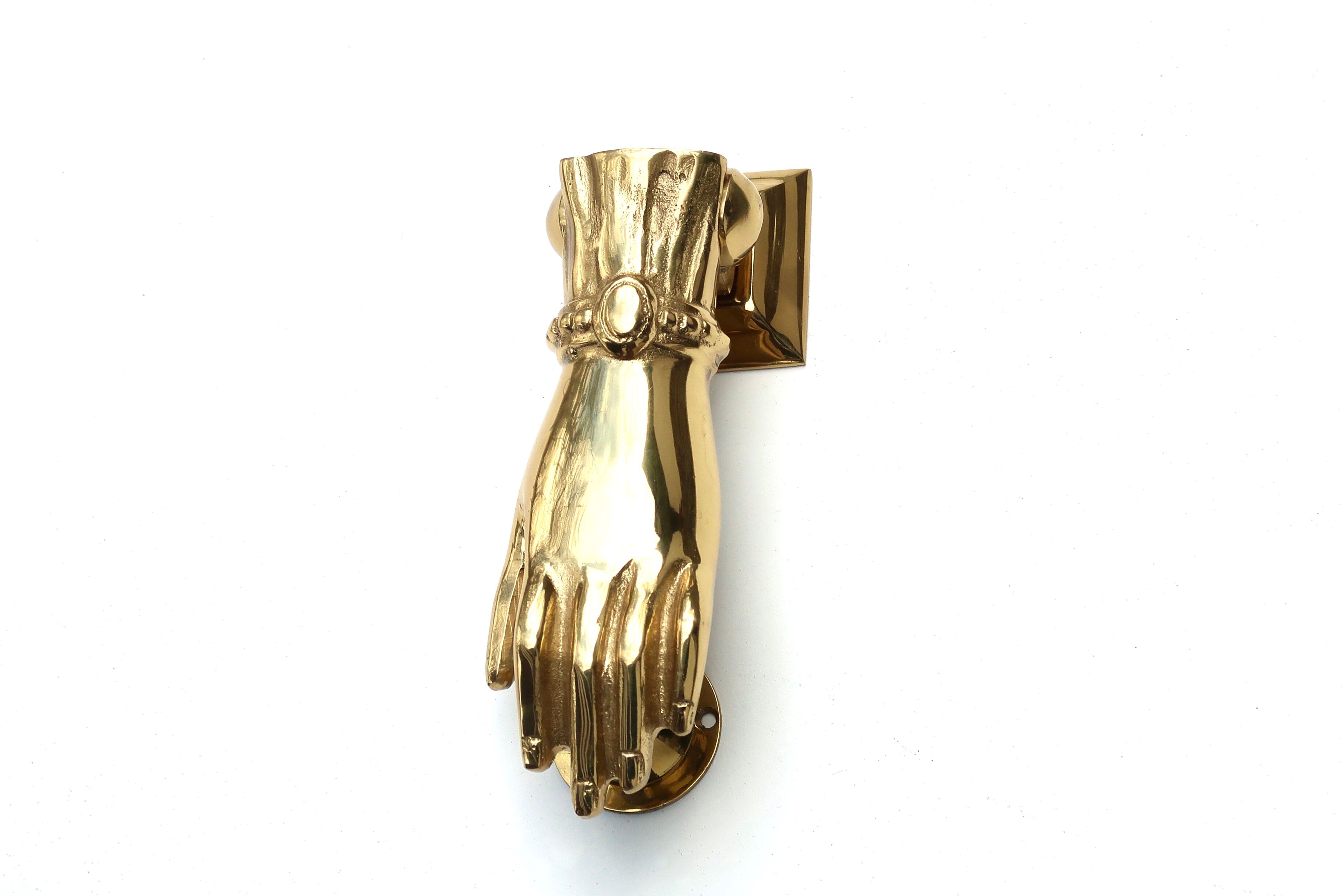 Brass hand-shaped door knocker, 1950s