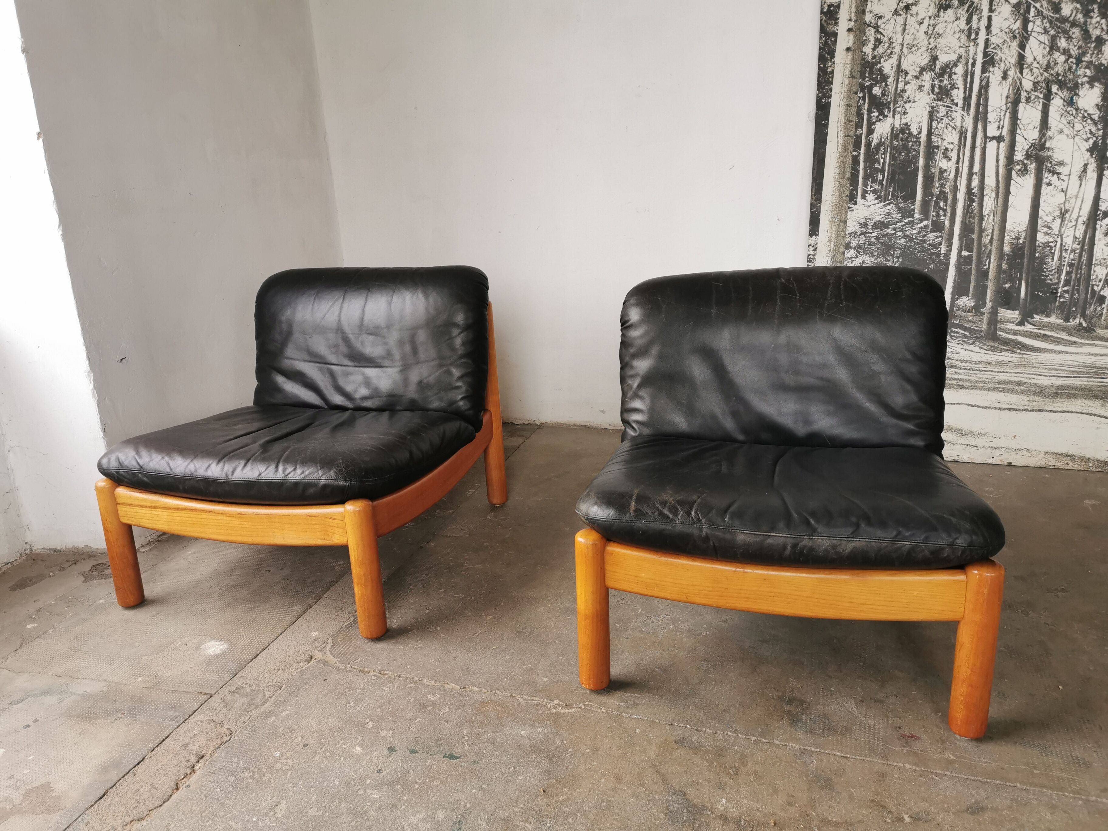 Pair of designer leather armchairs 80s