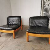Pair of designer leather armchairs 80s