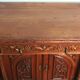 Art Nouveau buffet in carved oak with vine decoration