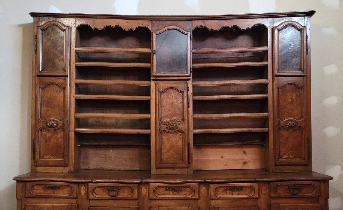 Clock cabinet from the Louis XV period in walnut and elm, fully carved.