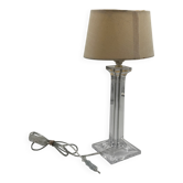 Modern table lamp in plexiglass with fabric shade.