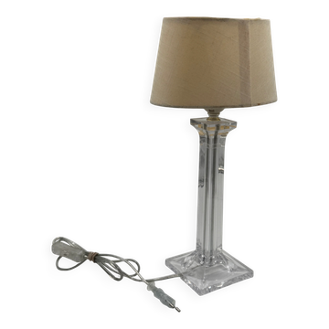 Modern table lamp in plexiglass with fabric shade.