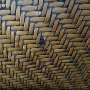 Woven rattan armchair and exotic wood in colonial style, 1980s.