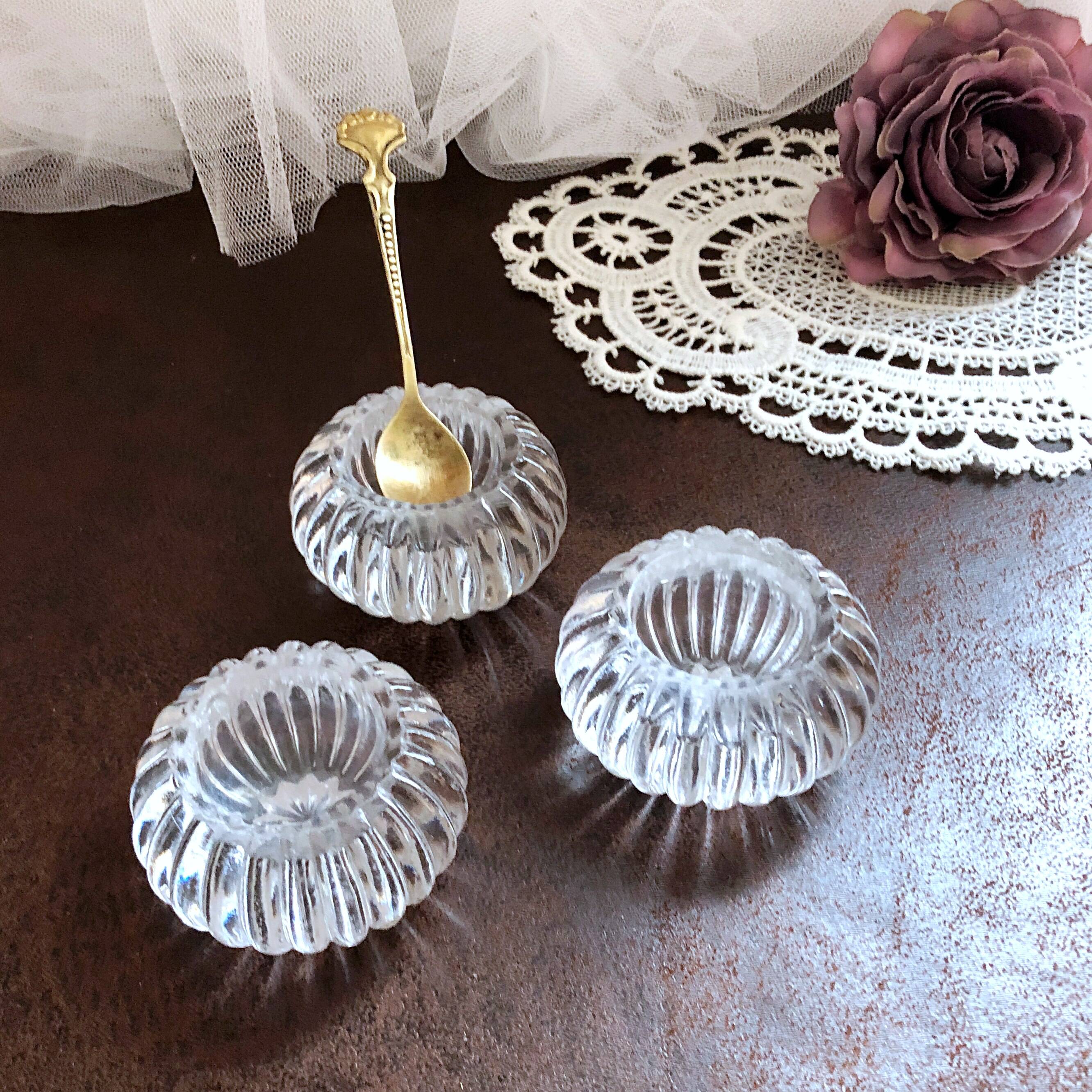 Trio of salt shakers, pepper shakers, molded glass salt shakers