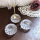 Trio of salt shakers, pepper shakers, molded glass salt shakers