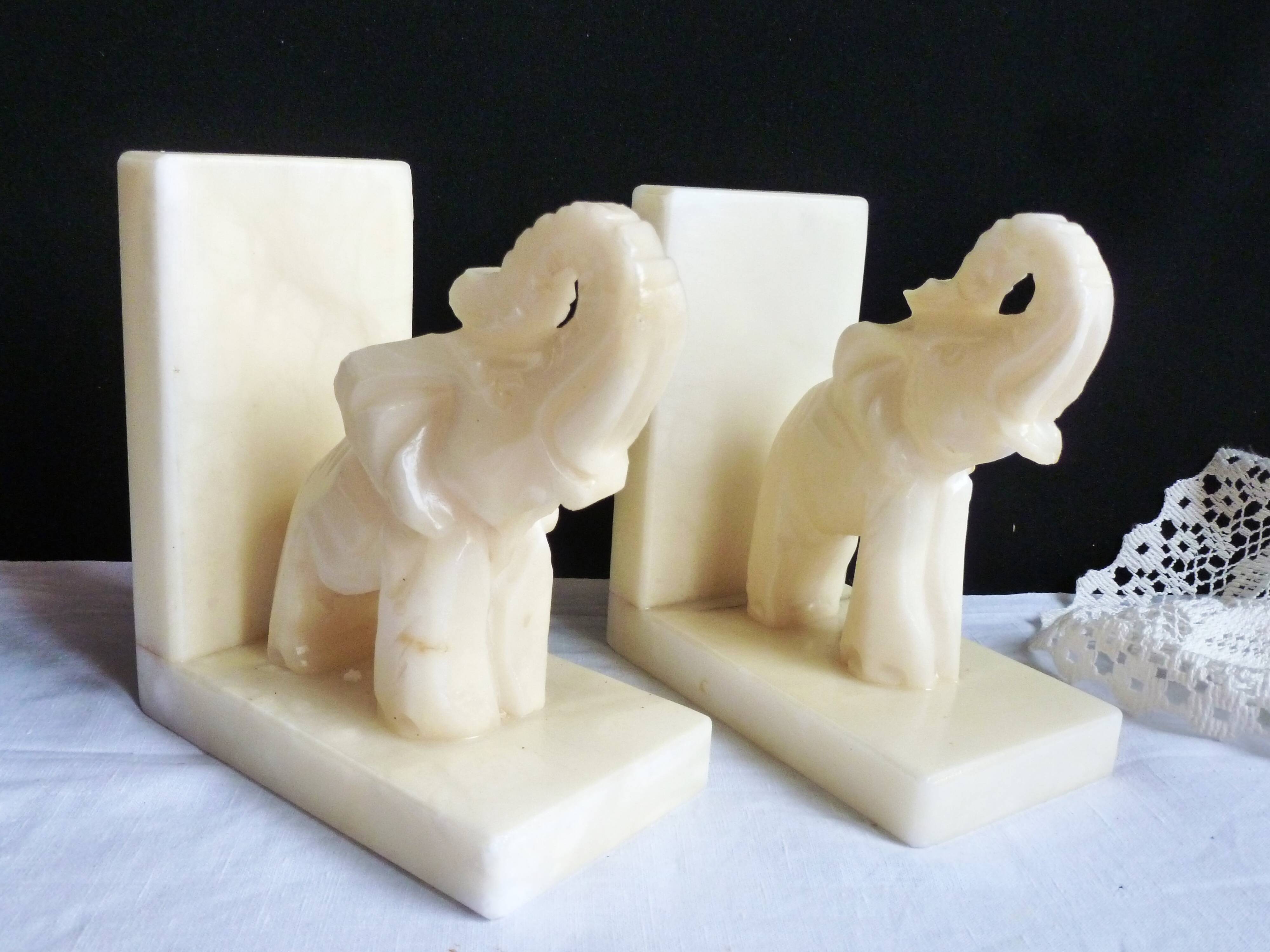 Elephant bookends in alabaster, Pair of elephant bookends.