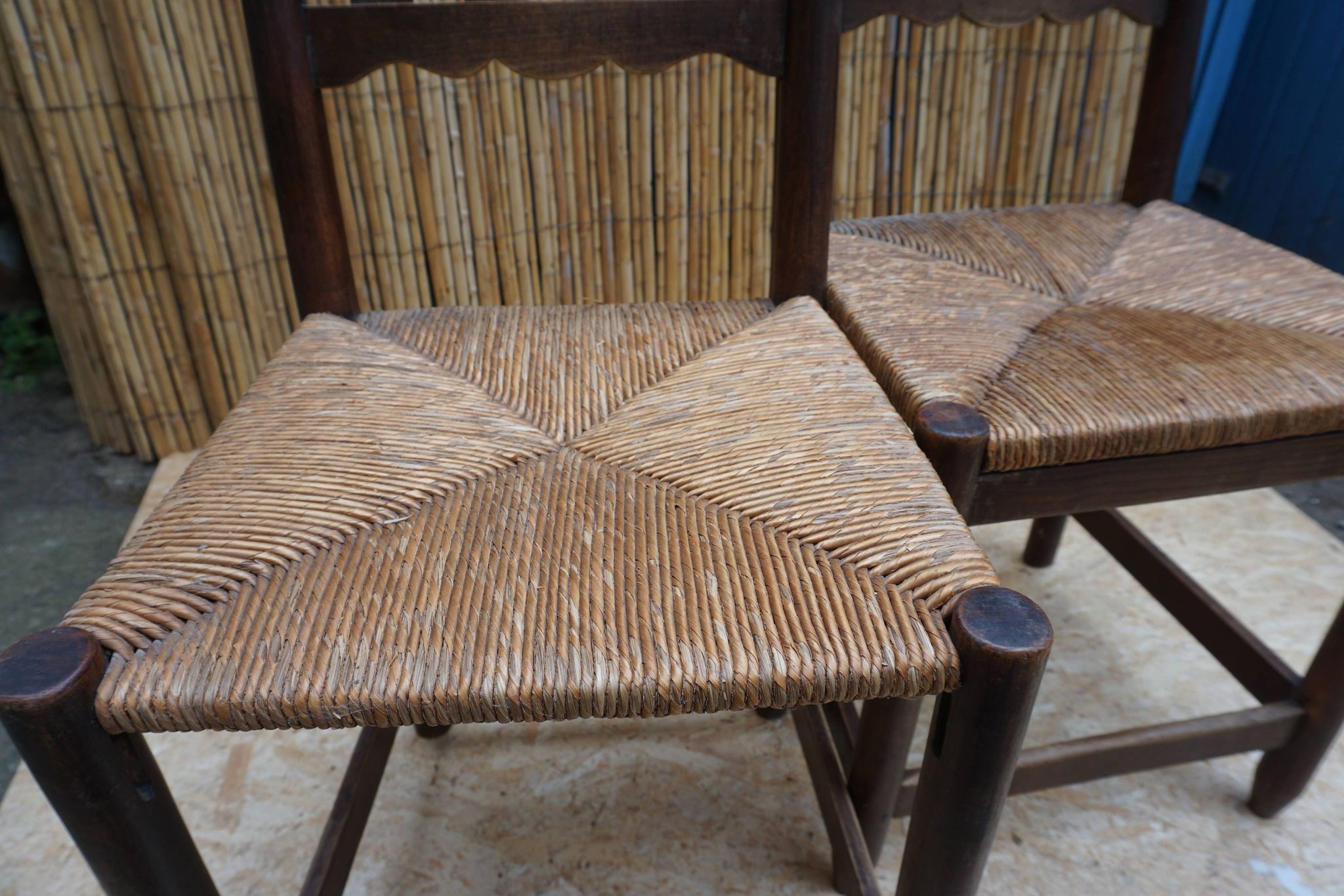 Pair of antique straw-seated farm chairs