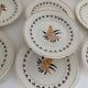 7 dessert plates and one Longwy dish