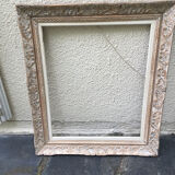 Carved wood frame.