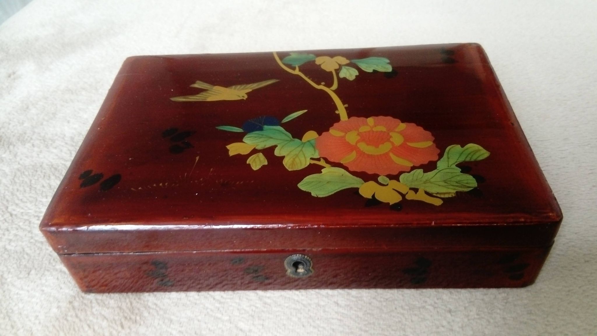 Old lacquered wooden box with china or japan decoration, bird and flower