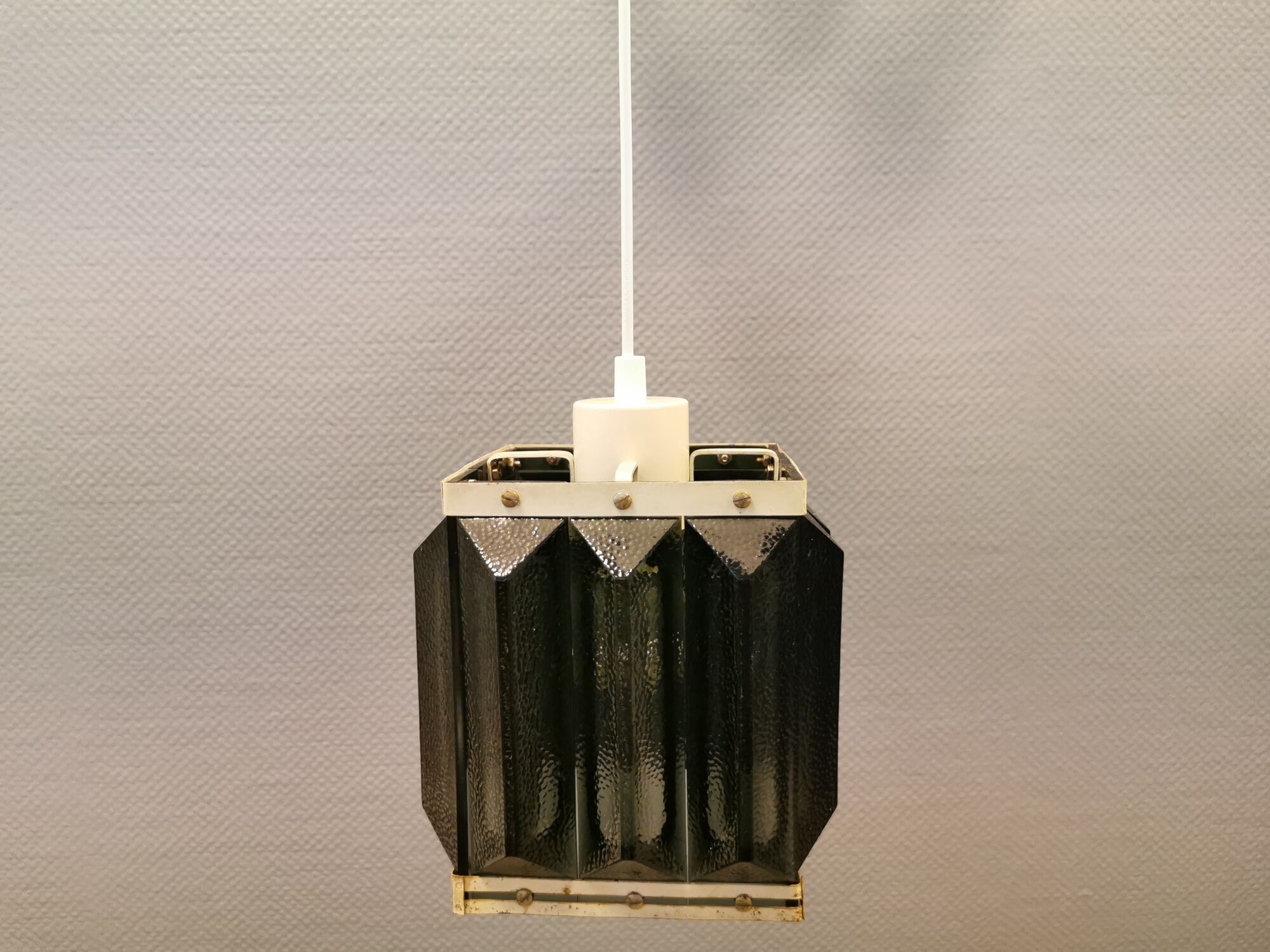 Old Swedish lamp made of metal and smoked solid glass pieces.