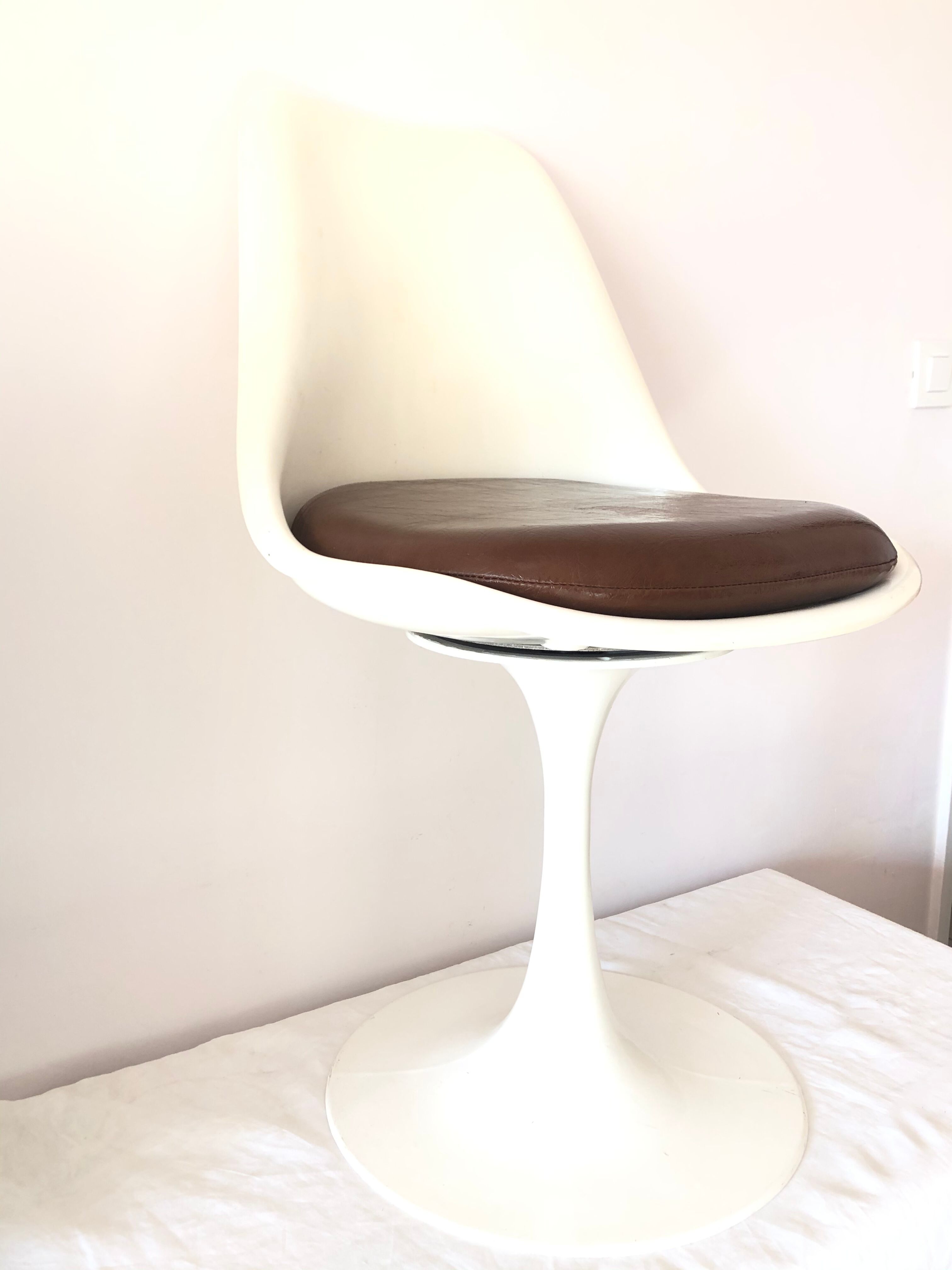 Pair of vintage tulip foot swivel chairs